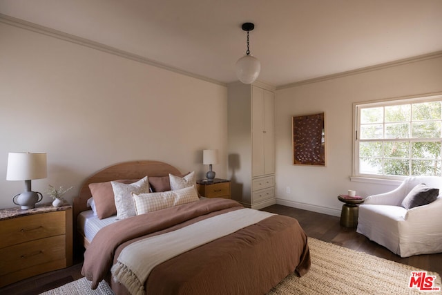 bedroom featuring dark wood-type flooring and ornamental molding