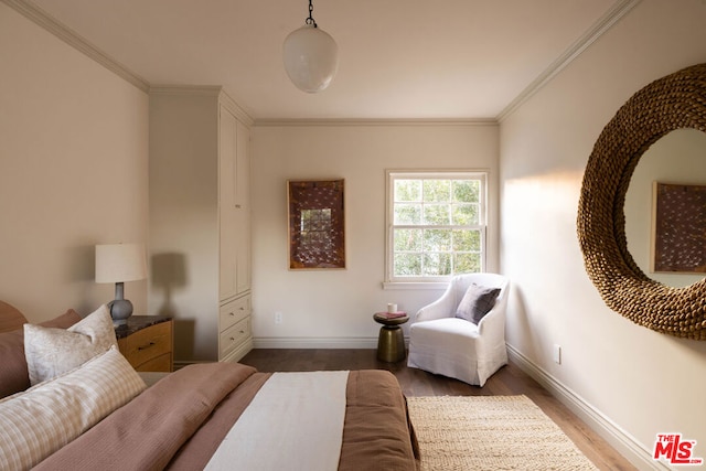 interior space with crown molding and hardwood / wood-style floors