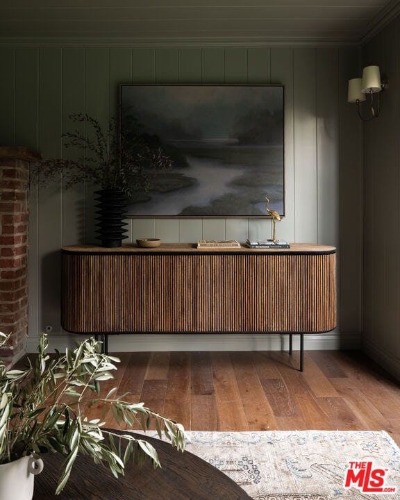 interior space featuring crown molding and hardwood / wood-style floors