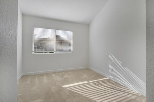 empty room featuring light colored carpet