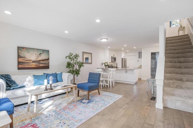 living room featuring light wood-type flooring