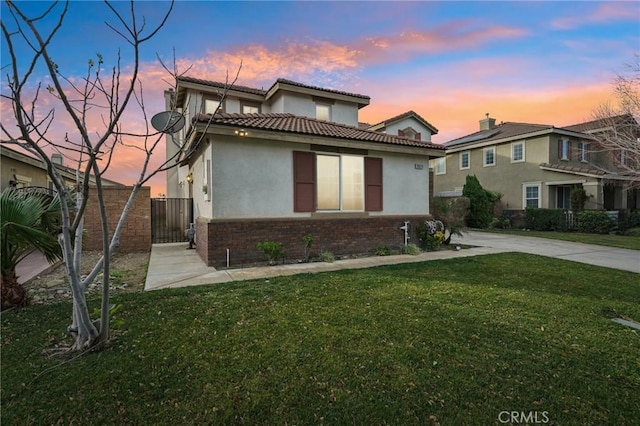 view of front of home with a yard