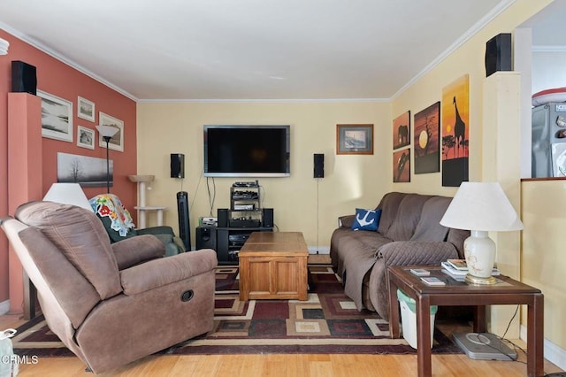 living room with ornamental molding and hardwood / wood-style flooring