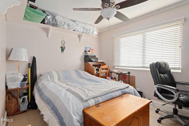 tiled bedroom featuring ceiling fan and ornamental molding