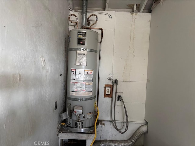 utility room with strapped water heater