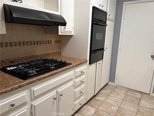 kitchen featuring white cabinets, black appliances, decorative backsplash, ventilation hood, and light tile patterned floors