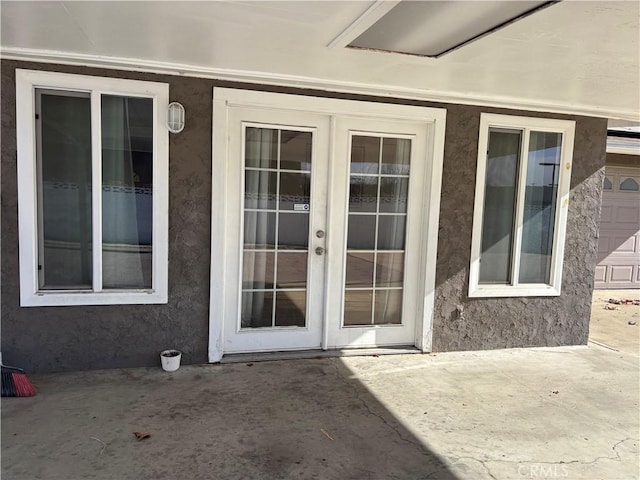 doorway to property featuring a patio area