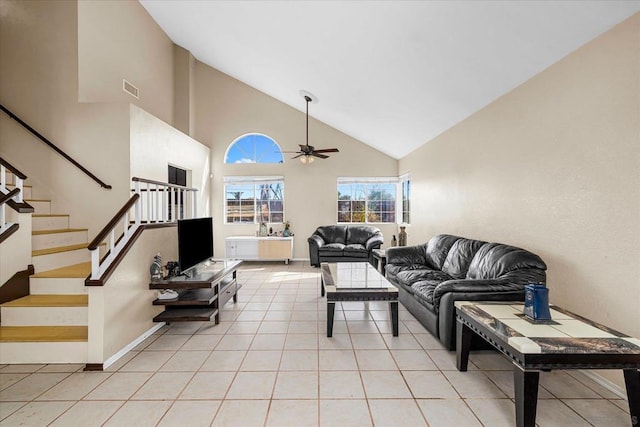 living room featuring ceiling fan, light tile patterned floors, and high vaulted ceiling