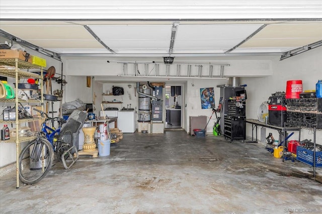 garage with washer / dryer and a garage door opener