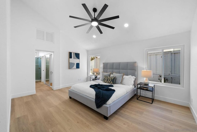 bedroom with ceiling fan, light hardwood / wood-style flooring, and high vaulted ceiling