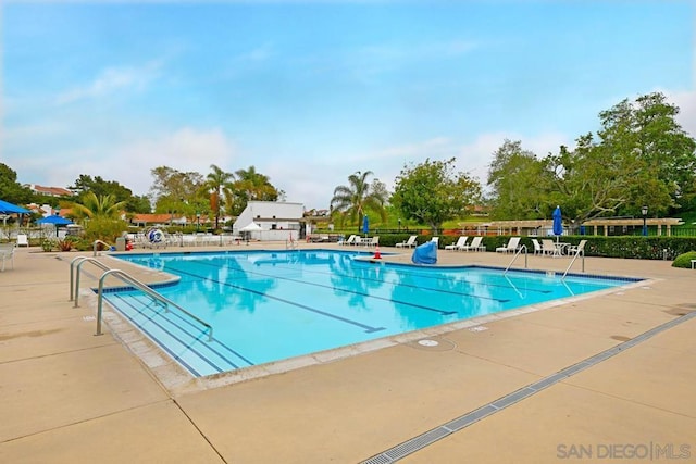 view of swimming pool featuring a patio area