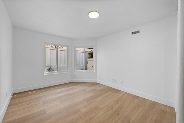 unfurnished room featuring light hardwood / wood-style flooring