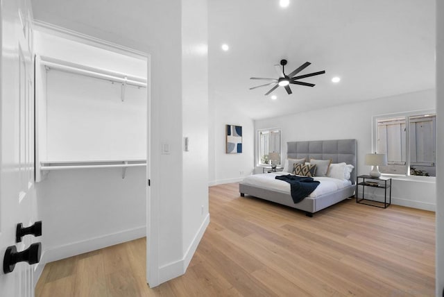 bedroom with ceiling fan and light hardwood / wood-style floors