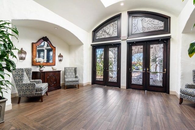 entryway with dark wood-type flooring and french doors