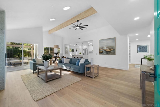 living room with high vaulted ceiling, ceiling fan, light hardwood / wood-style flooring, and beamed ceiling