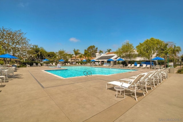 view of swimming pool featuring a patio area