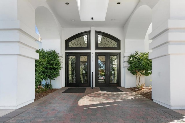 property entrance featuring french doors