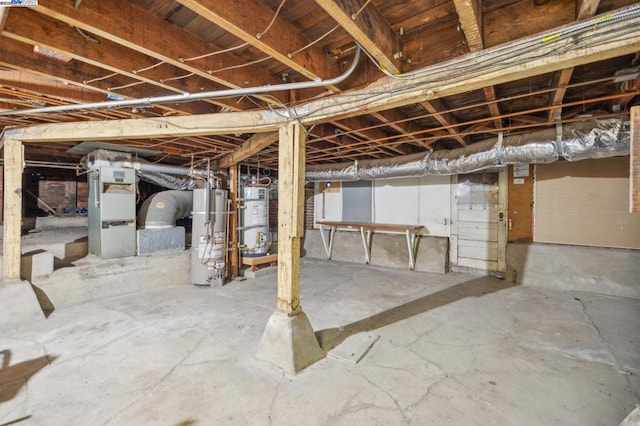 basement featuring secured water heater and water heater