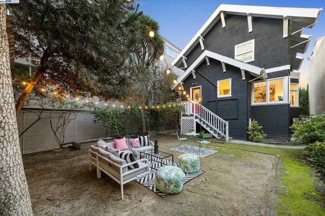 back of property featuring an outdoor living space