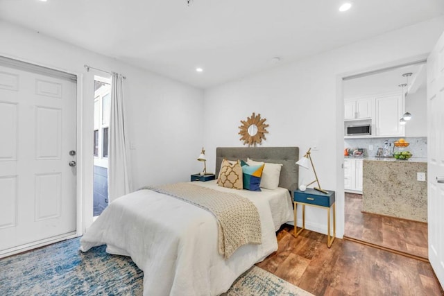 bedroom featuring dark wood-type flooring