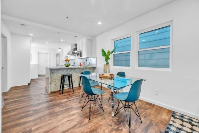 dining space featuring dark hardwood / wood-style floors