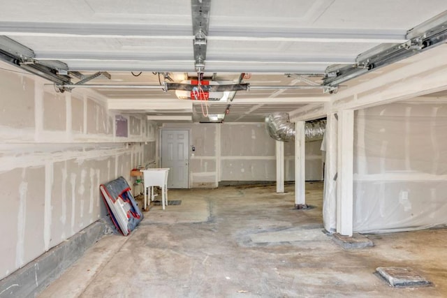 garage featuring a garage door opener and sink