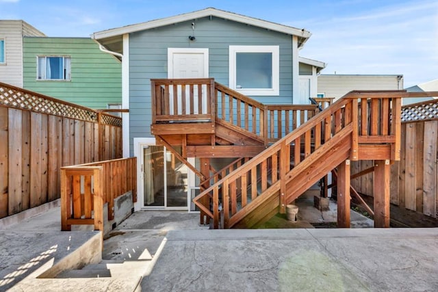 rear view of property with a wooden deck