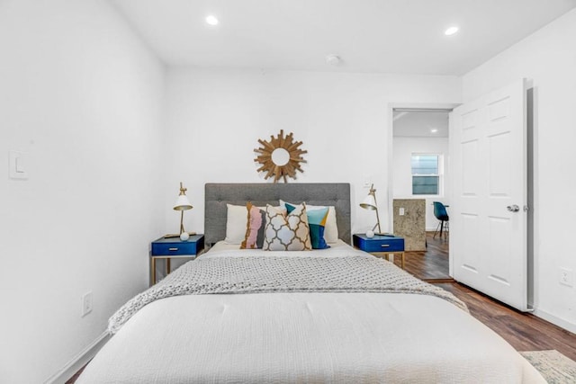 bedroom featuring dark hardwood / wood-style flooring