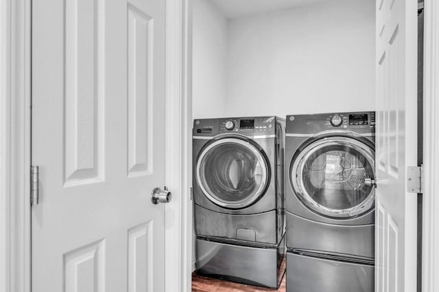 washroom featuring washing machine and dryer