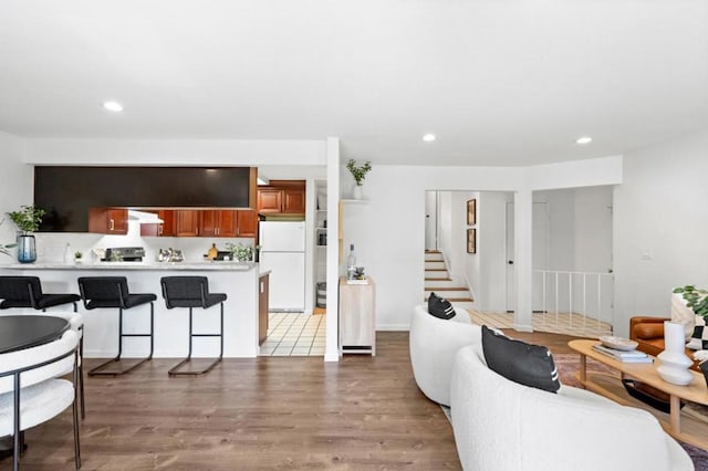 living room with light hardwood / wood-style flooring