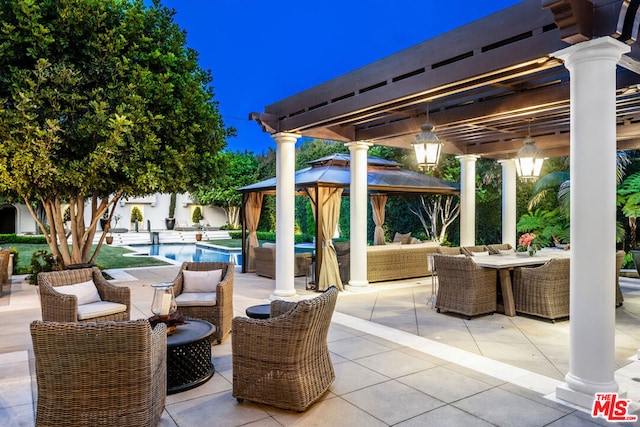 view of patio / terrace with outdoor lounge area and a gazebo