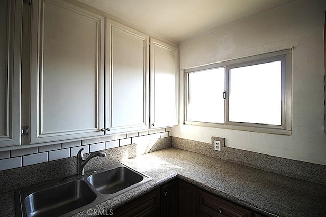 kitchen with sink and white cabinets