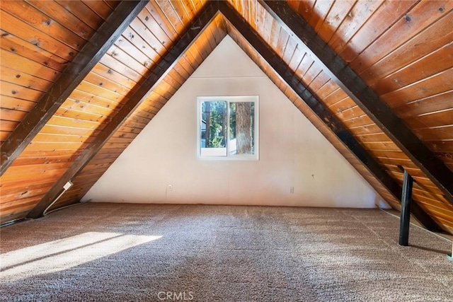 bonus room featuring carpet floors, wood ceiling, and vaulted ceiling with beams