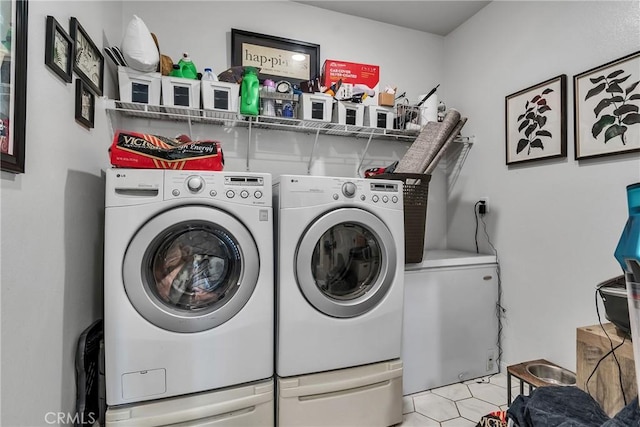 clothes washing area featuring washer and clothes dryer