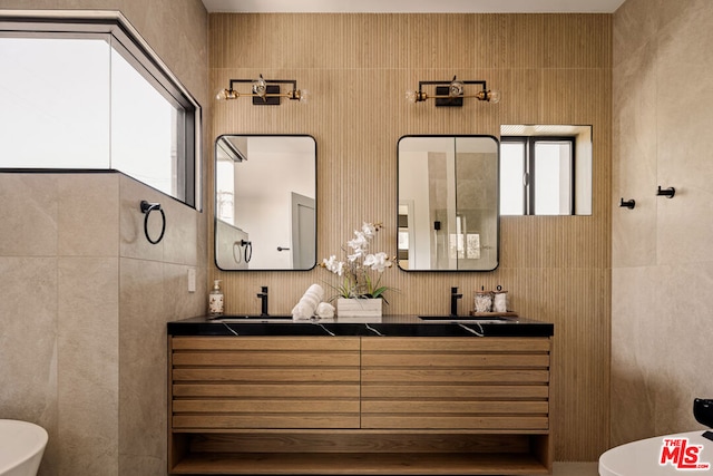 bathroom featuring tile walls and vanity