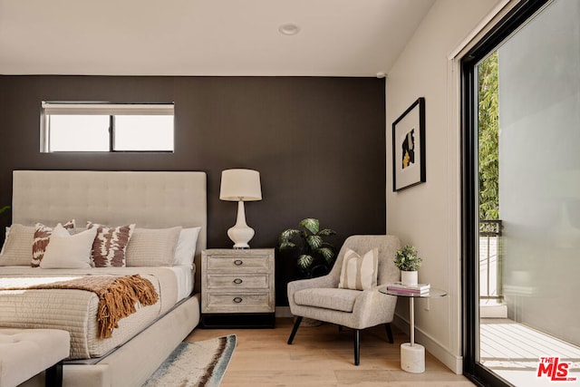 bedroom with light hardwood / wood-style flooring