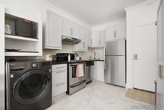 kitchen with washer / dryer, stainless steel appliances, tasteful backsplash, ornamental molding, and white cabinets