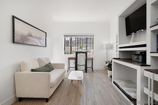 interior space featuring hardwood / wood-style flooring and built in shelves