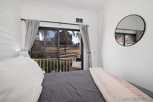 bedroom with access to exterior and ornamental molding