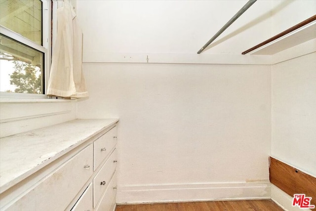 interior space with hardwood / wood-style flooring and vanity