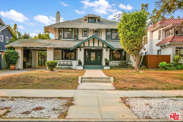 view of front of home featuring covered porch