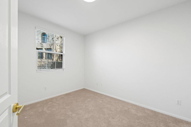 empty room featuring light colored carpet