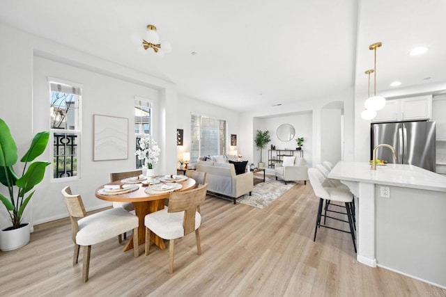 dining space featuring light wood-type flooring