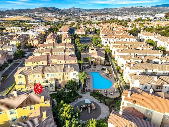 birds eye view of property featuring a mountain view