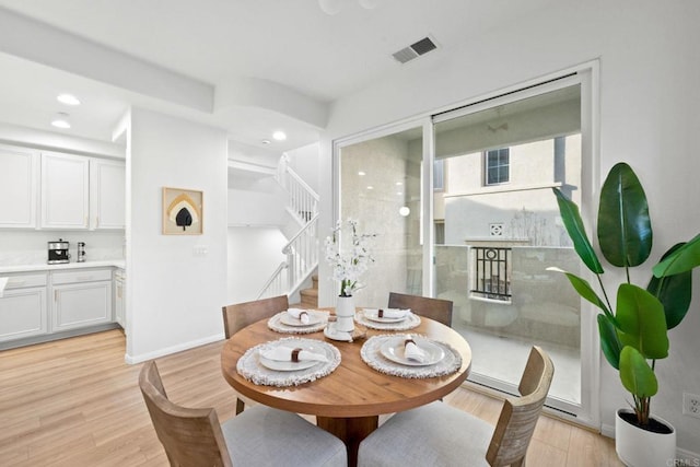 dining room featuring light hardwood / wood-style flooring