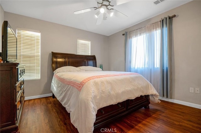 bedroom featuring ceiling fan and dark hardwood / wood-style flooring