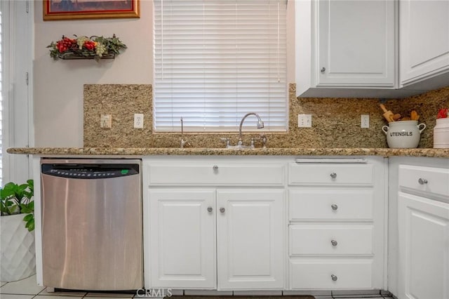 kitchen with white cabinetry, dishwasher, backsplash, and light stone counters