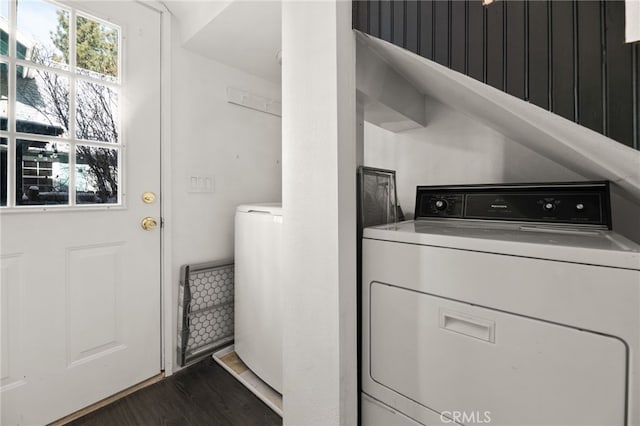 laundry area with washer / clothes dryer and dark hardwood / wood-style flooring