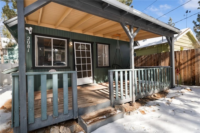 property entrance with a wooden deck