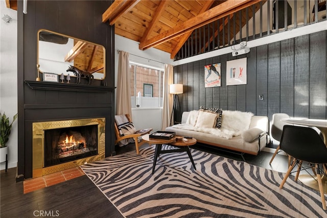 living room with dark hardwood / wood-style floors, wood walls, beam ceiling, wood ceiling, and high vaulted ceiling